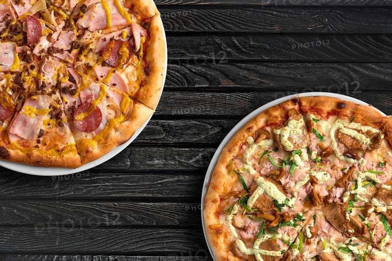 Top view of two pizzas on the table with copy space for text