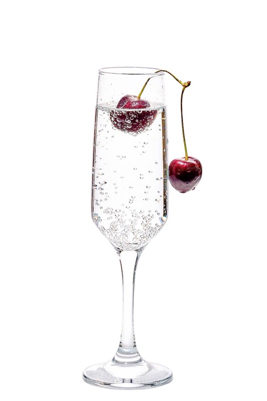 Gin and tonic with cherry isolated on white background