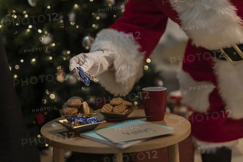 Santa claus having christmas cookies