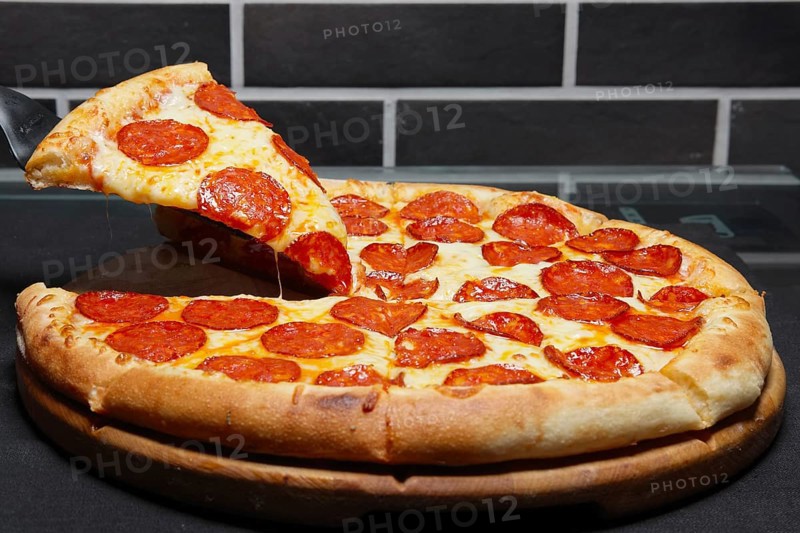 Slice of pizza pepperoni on scapula