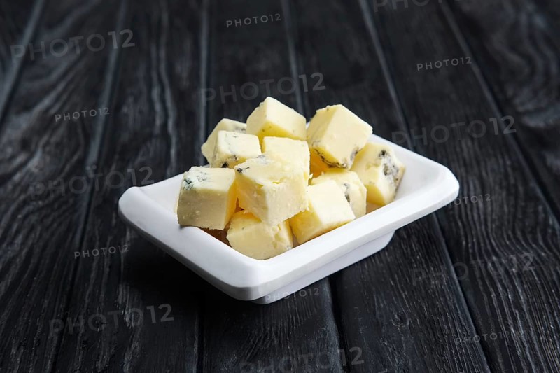 Small square pieces of blue cheese. Cheese with fungus