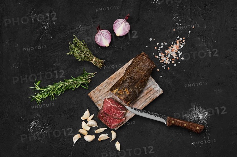 Beef jerky on wooden cutting board