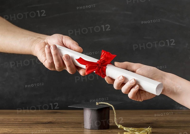 People handing a diploma to each other 1