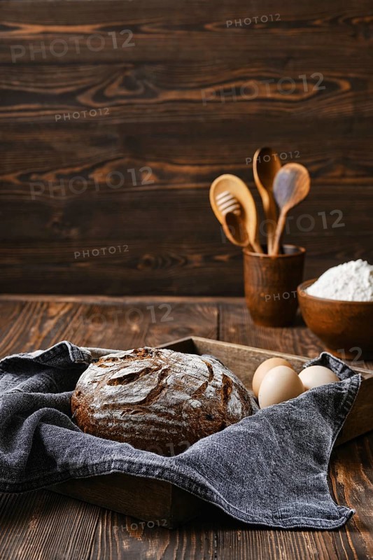 Fresh rye brown bread on wooden cutting board