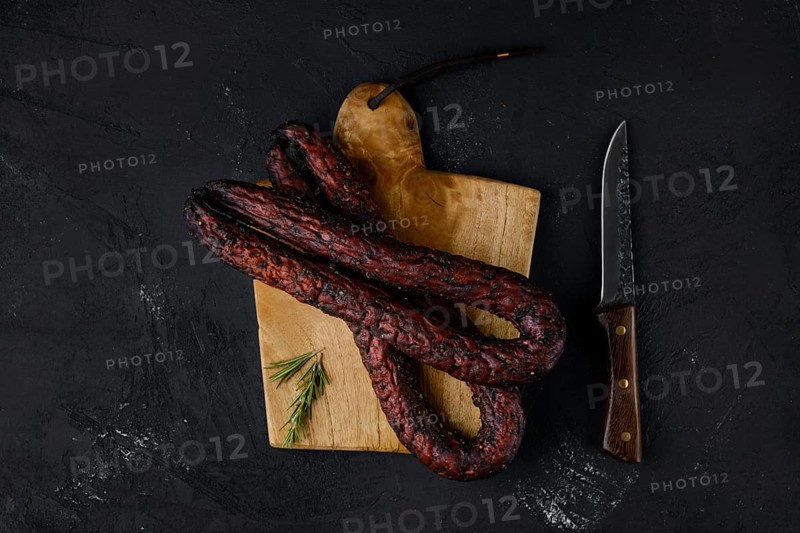 Top view of smoked beef sausage on cutting board