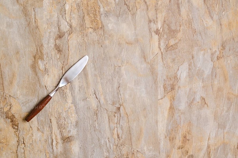Spreading knife on empty wooden surface