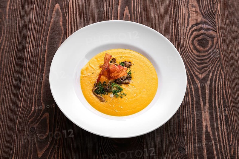Mashed pumpkin soup puree with bacon
