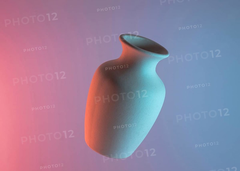 White plain ceramic vase air against colored blue pink backdrop. Resolution and high quality beautiful photo
