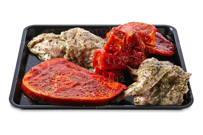 Marinated varieties of meat ready for grilling isolated on white background