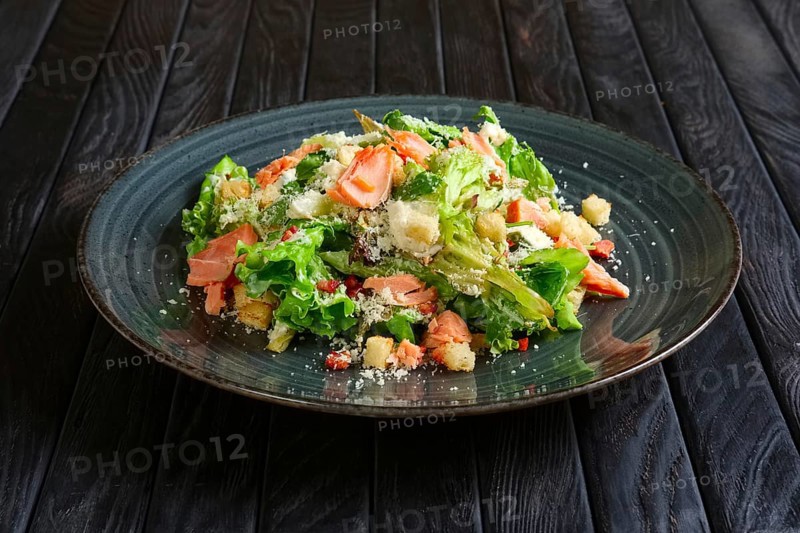 Plate with smoked salmon salad with chips