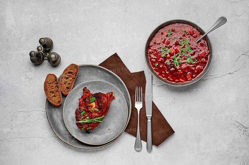 Top view of ossobuco on a plate. Slice of shank baked with wine sauce