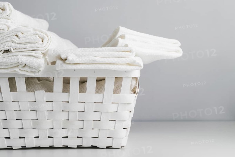Front view white basket with towels