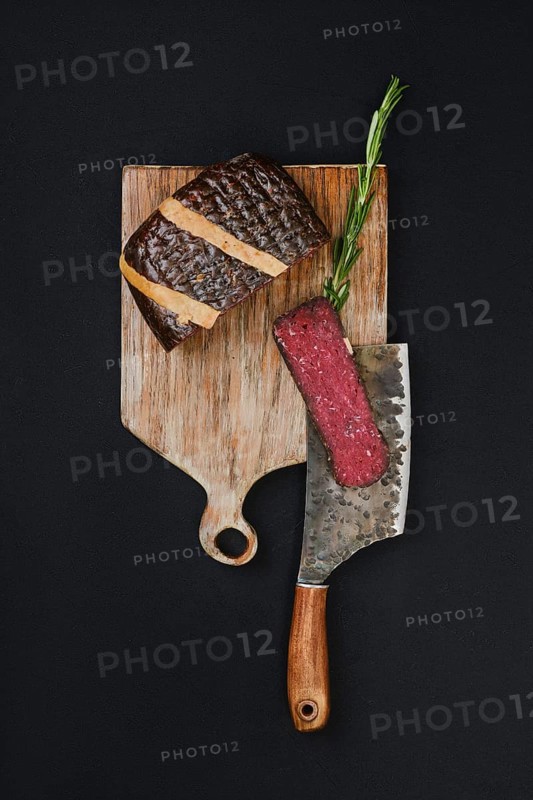 Top view of slice cured beef ham on cutting board