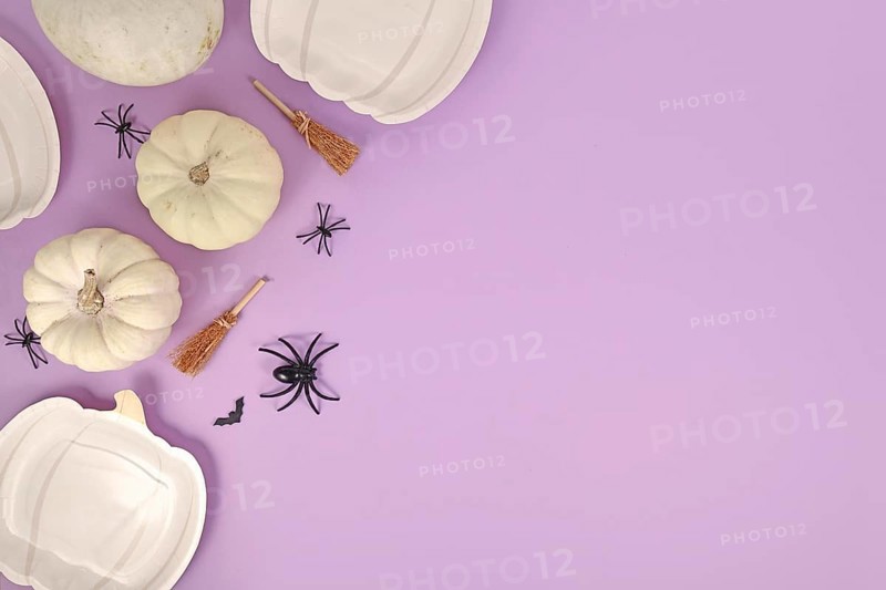 Halloween party flat lay with pumpkin shaped plates