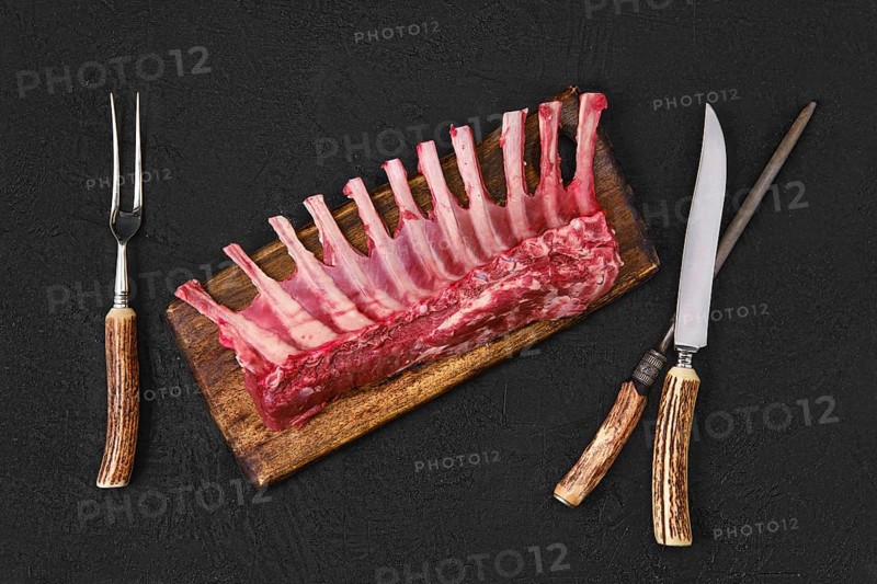 Overhead view of raw fresh rack of lamb on kitchen table