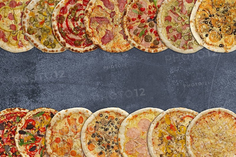Horizontal collage of different baked pizzas on metal plate. Top view