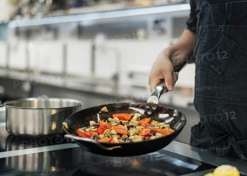 Chef with apron cooking dish kitchen