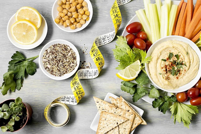 Top view hummus with assortment vegetables measuring tape. Resolution and high quality beautiful photo