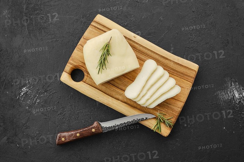 Homemade country style goat cheese on cutting board