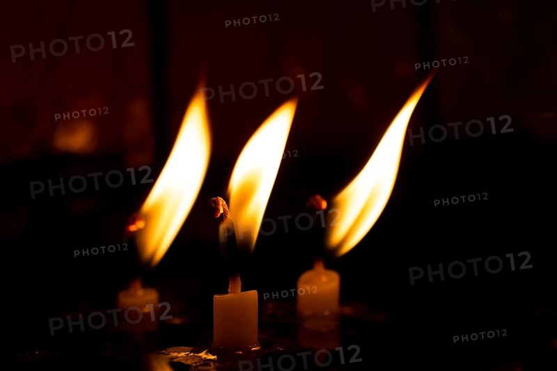 Burning candle making light in view