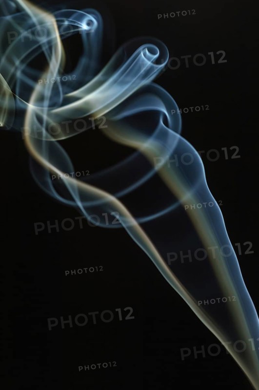 Trajectory of incense smoke in the air showing different shapes. France