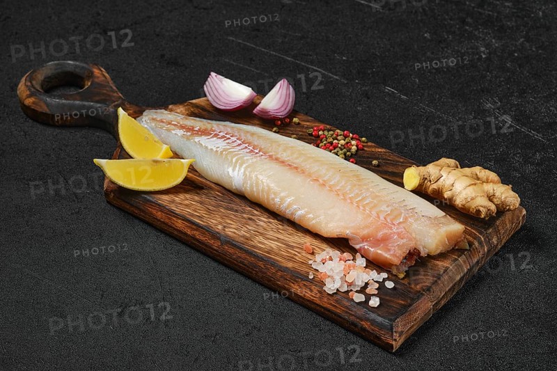 Frozen zander fillet on cutting board