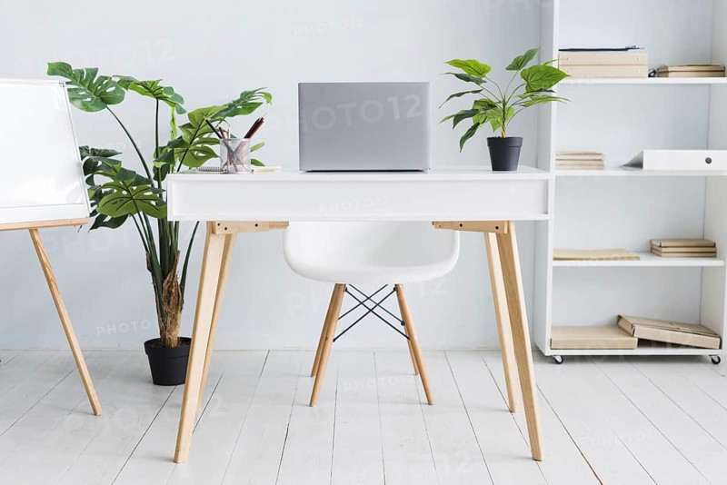 Office employee workspace with laptop table