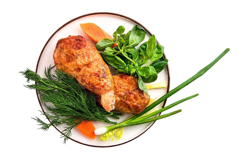 Stuffed chicken thigh decorated with spring onion