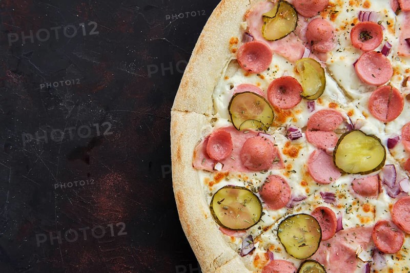Close up view of pizza with frankfurter