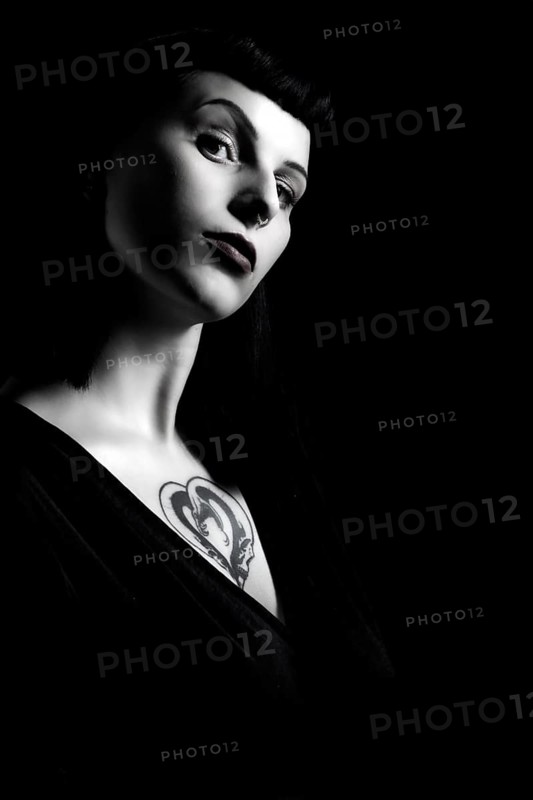 Portrait young woman with breast tattoo