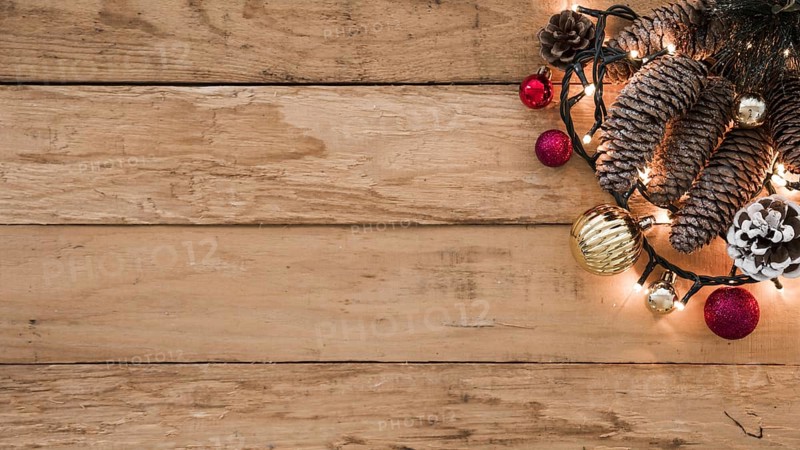 Cones with burning garland on table