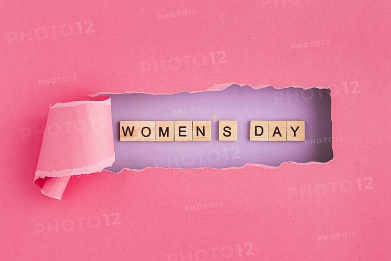Women s day written in scrabble letters and torn paper. Resolution and high quality beautiful photo