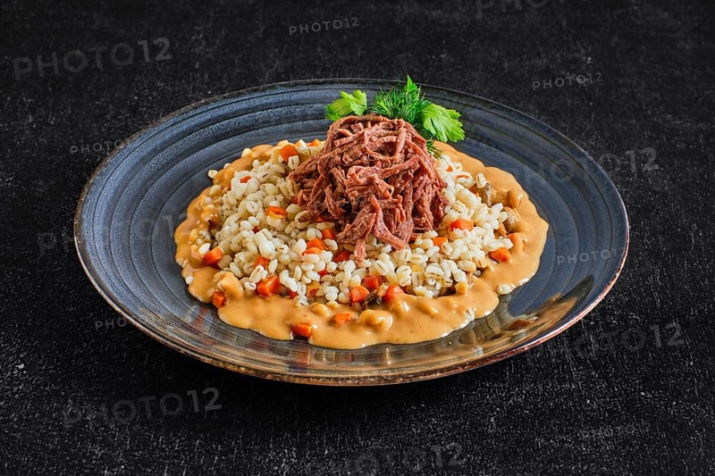 Pulled beef with pearl barley and creamy sauce