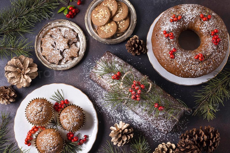Top view of christmas desserts with red berries and pine cones. Resolution and high quality beautiful photo