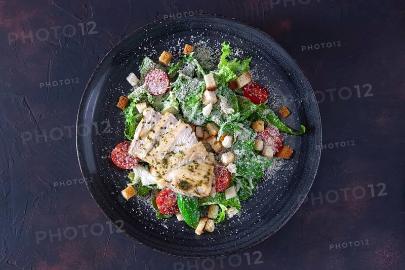 Fried chicken fillet with arugula