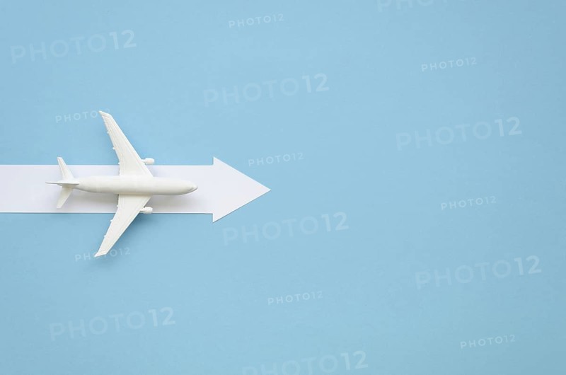 Copy space airplane with arow direction
