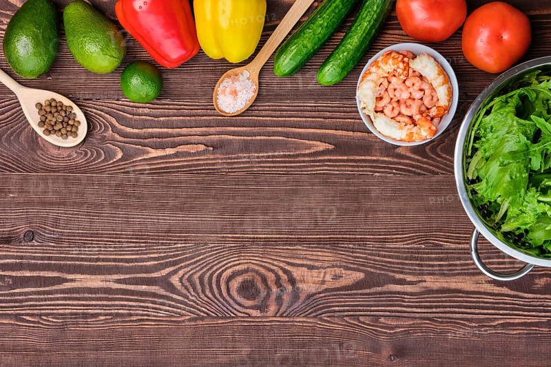 Fresh vegetables and spices on wooden table