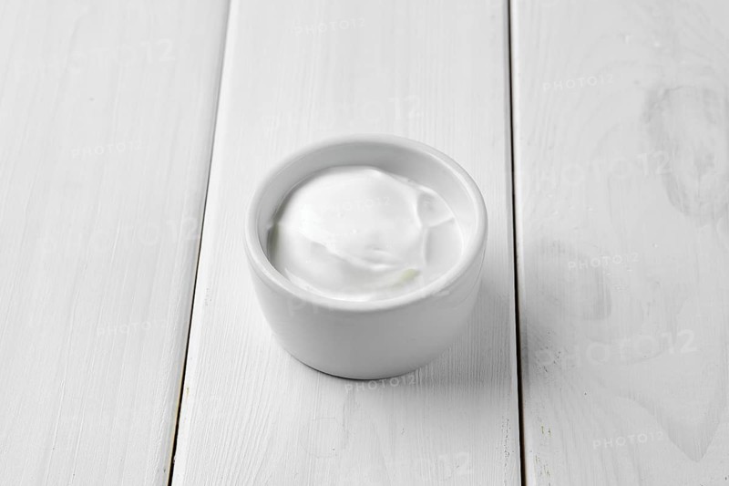 Sour cream in ceramic gravy boat
