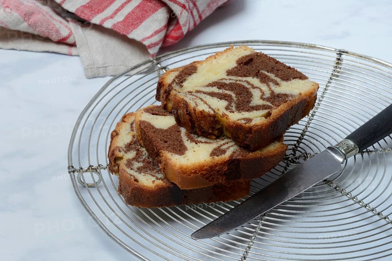 Marble cake and knife on cake rack