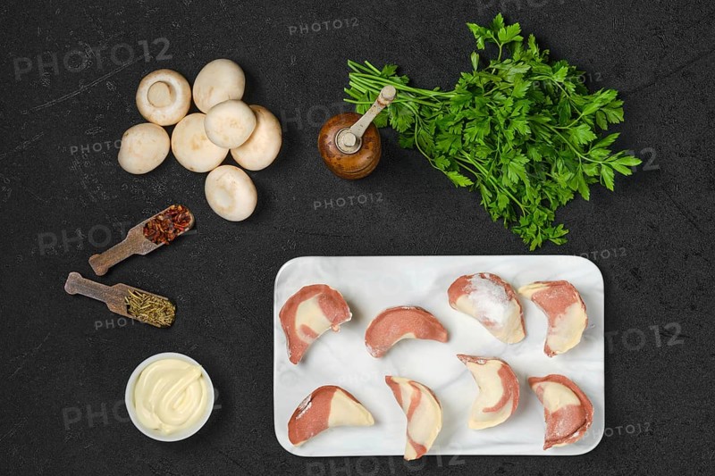 Top view of frozen semifinished dumplings stuffed with mushrooms