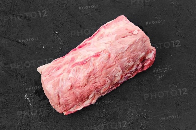 Raw fresh pork collar joint meat on black background