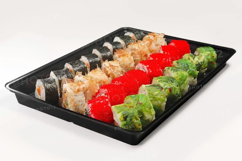 Plastic tray with set of rolls with smoked salmon