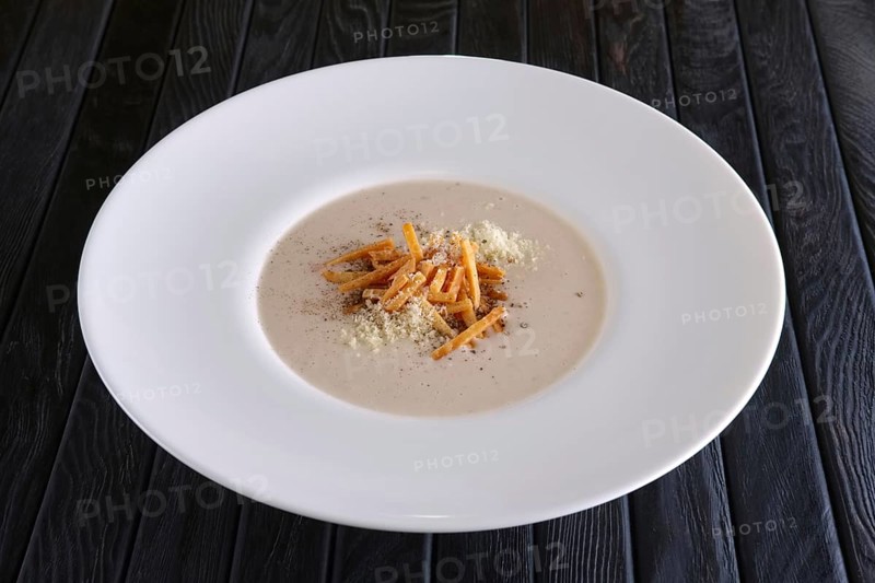 Mushroom soup puree with bacon flakes