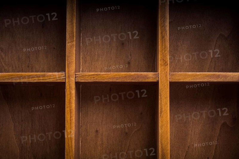 Close up of a wooden box with compartments
