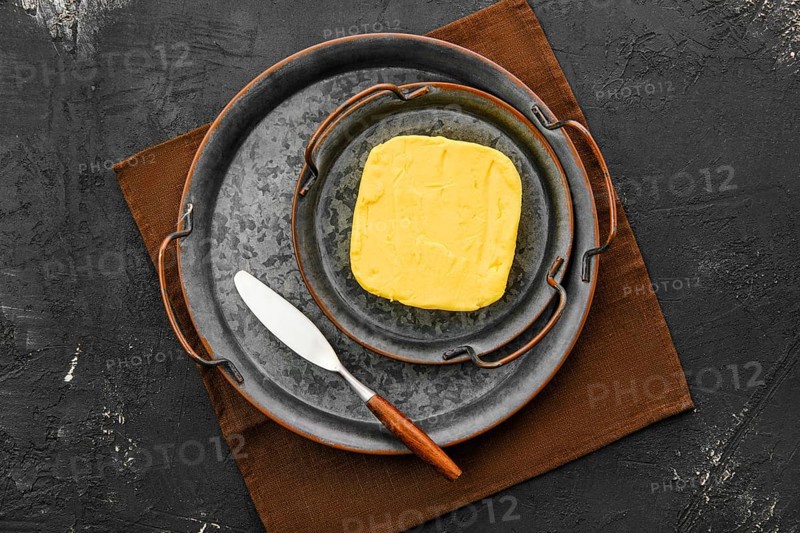 Homemade rustic butter and a spreading knife