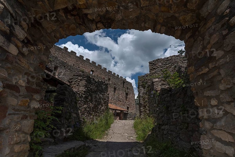 View through the entrance gate into the interior of the medieval Eisenberg castle ruins