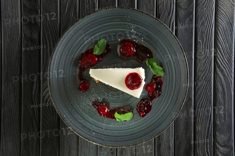 Top view of cheese cake decorated with cherry