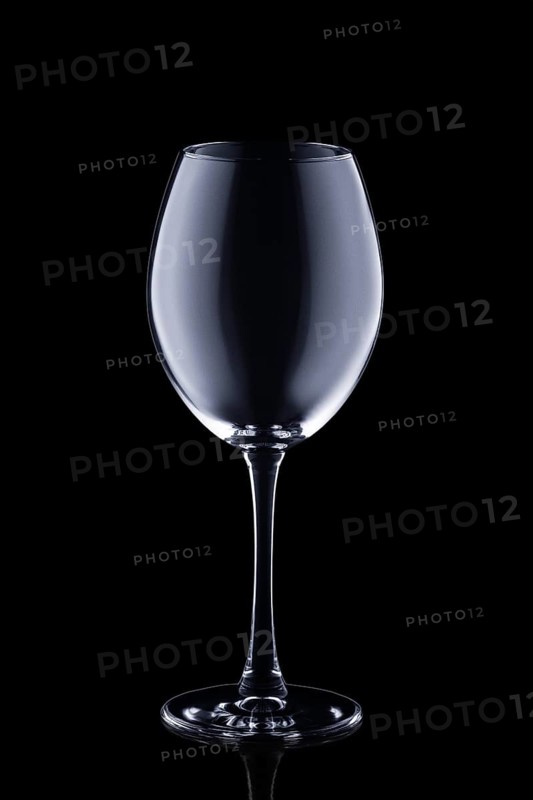 Empty wine glass isolated on black background