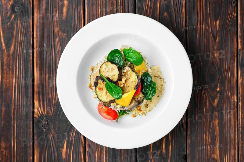 Top view of roasted aubergine with bell pepper