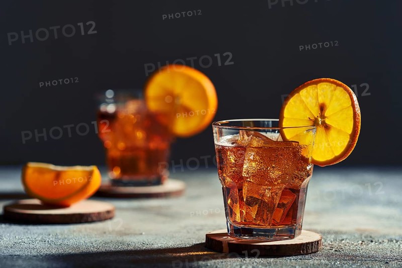 Cocktail old fashioned with hard light and harsh shadows